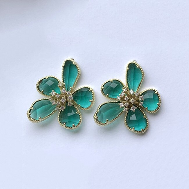 Aretes Rotativos Flor de la Riqueza con Circonitas Incrustadas